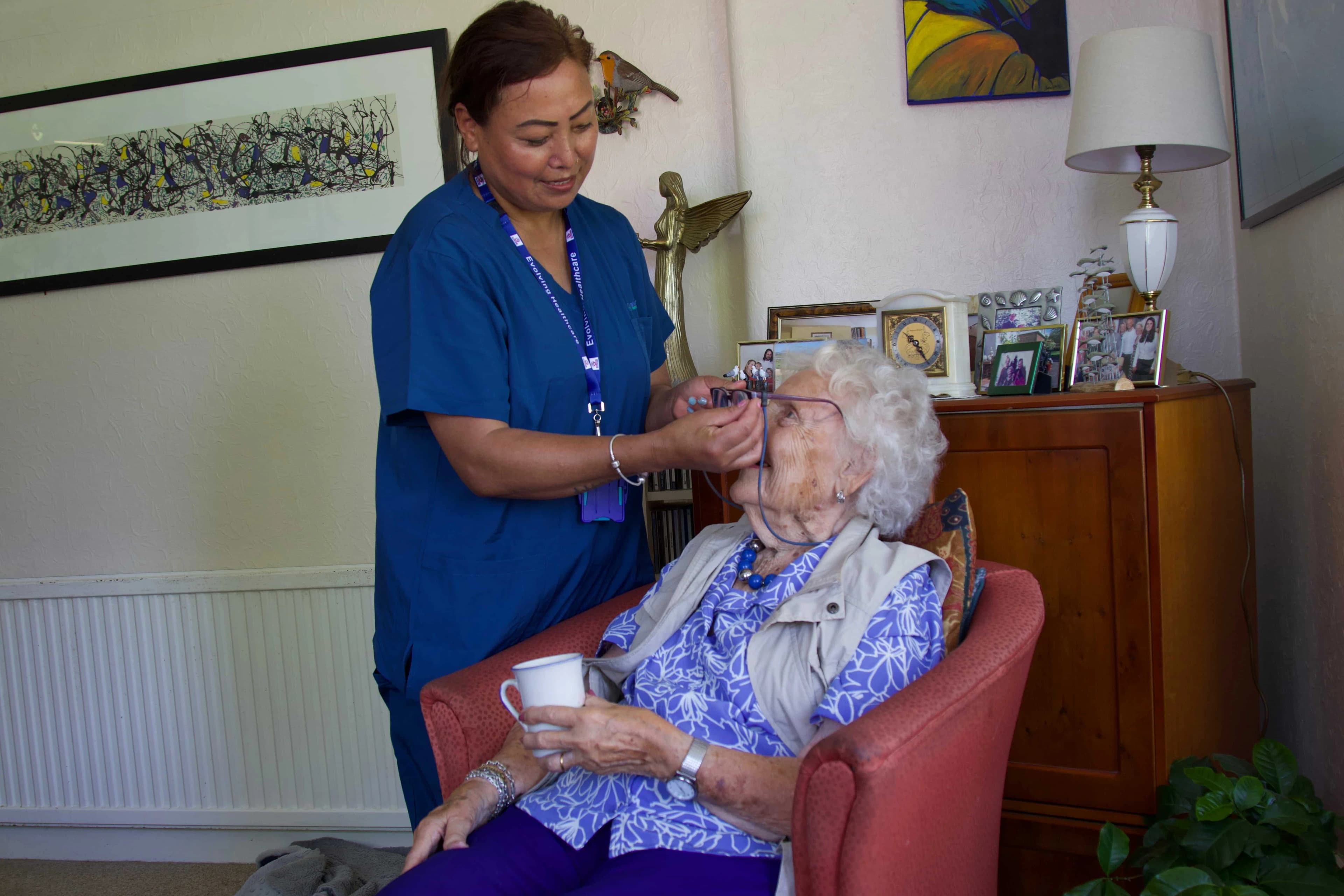 Residents enjoying time together outdoors in the care home grounds
